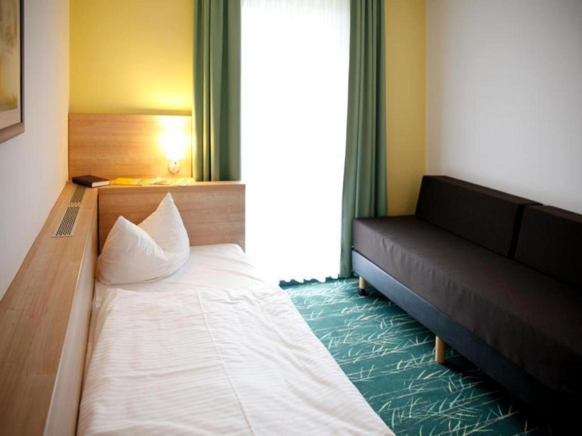 Ein Bett oder Betten in einem Zimmer der Unterkunft Kaiserhof Feldberg by Belvilla Resorts