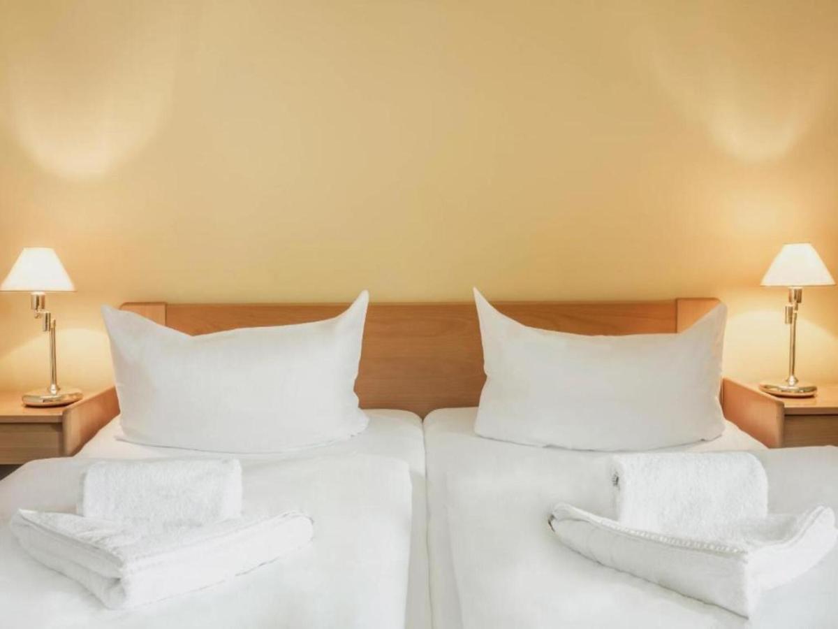 Ein Bett oder Betten in einem Zimmer der Unterkunft Kaiserhof Feldberg by Belvilla Resorts
