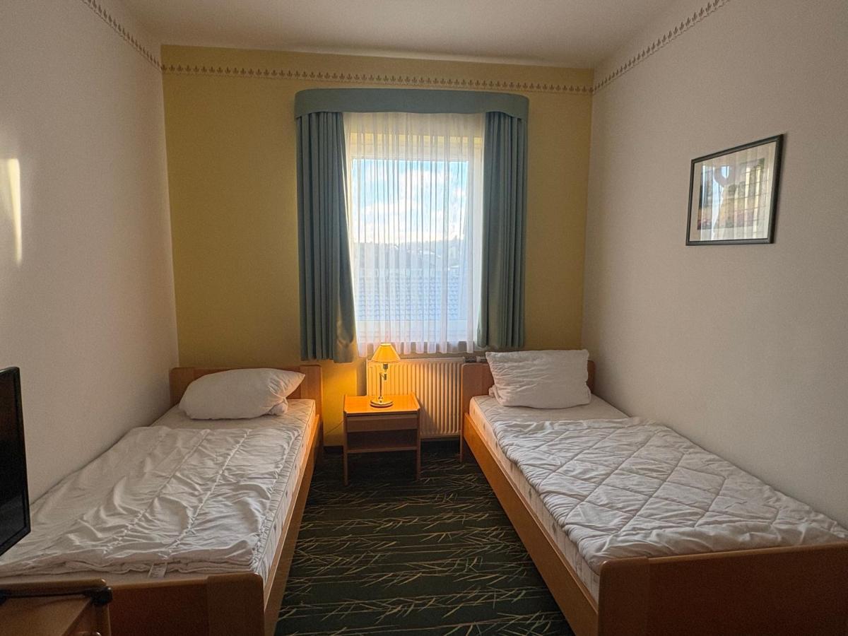 Ein Bett oder Betten in einem Zimmer der Unterkunft Kaiserhof Feldberg by Belvilla Resorts