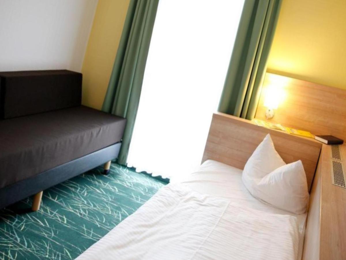Ein Bett oder Betten in einem Zimmer der Unterkunft Kaiserhof Feldberg by Belvilla Resorts