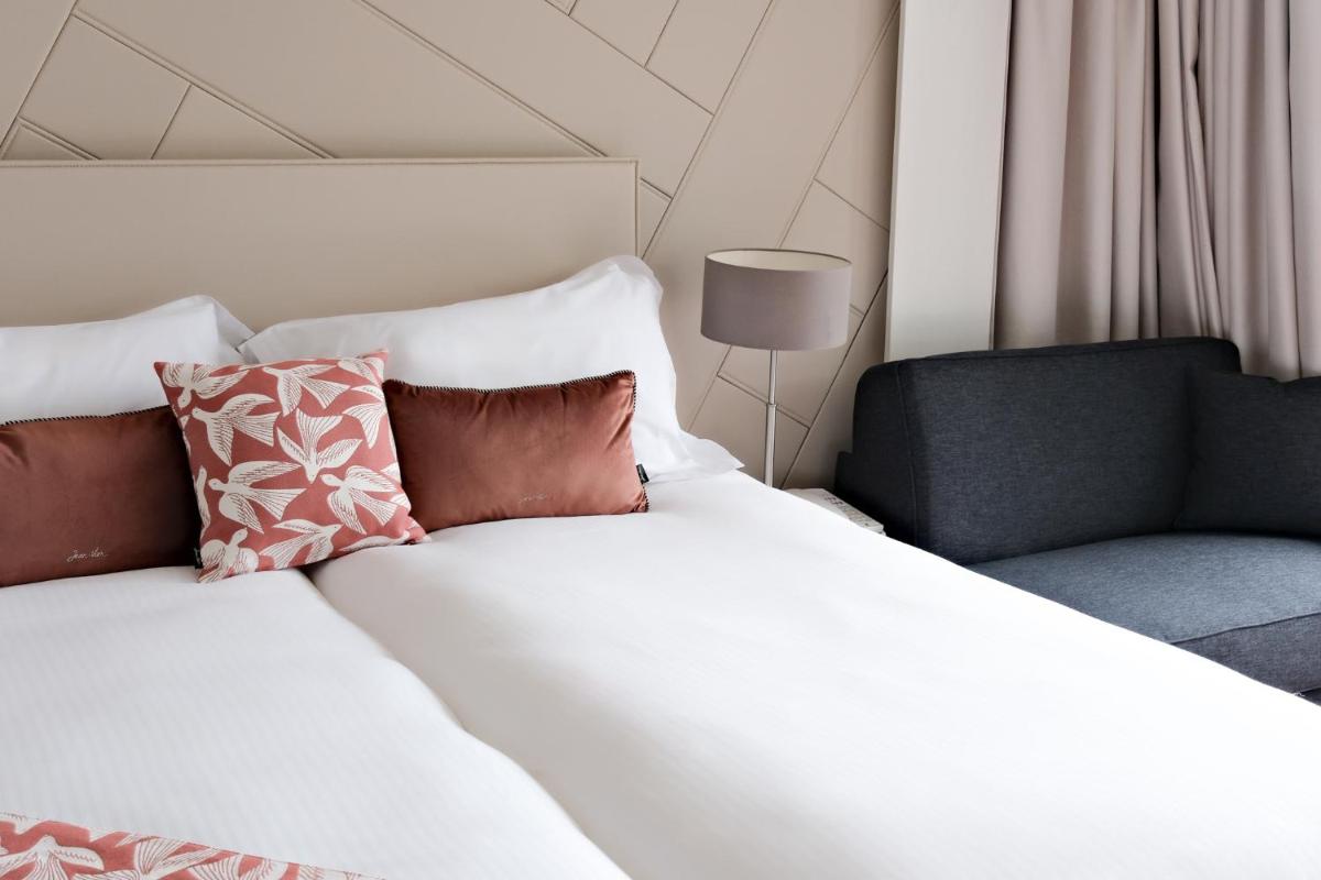 Un ou plusieurs lits dans un hébergement de l'établissement Thalazur Cabourg - Hôtel & Spa