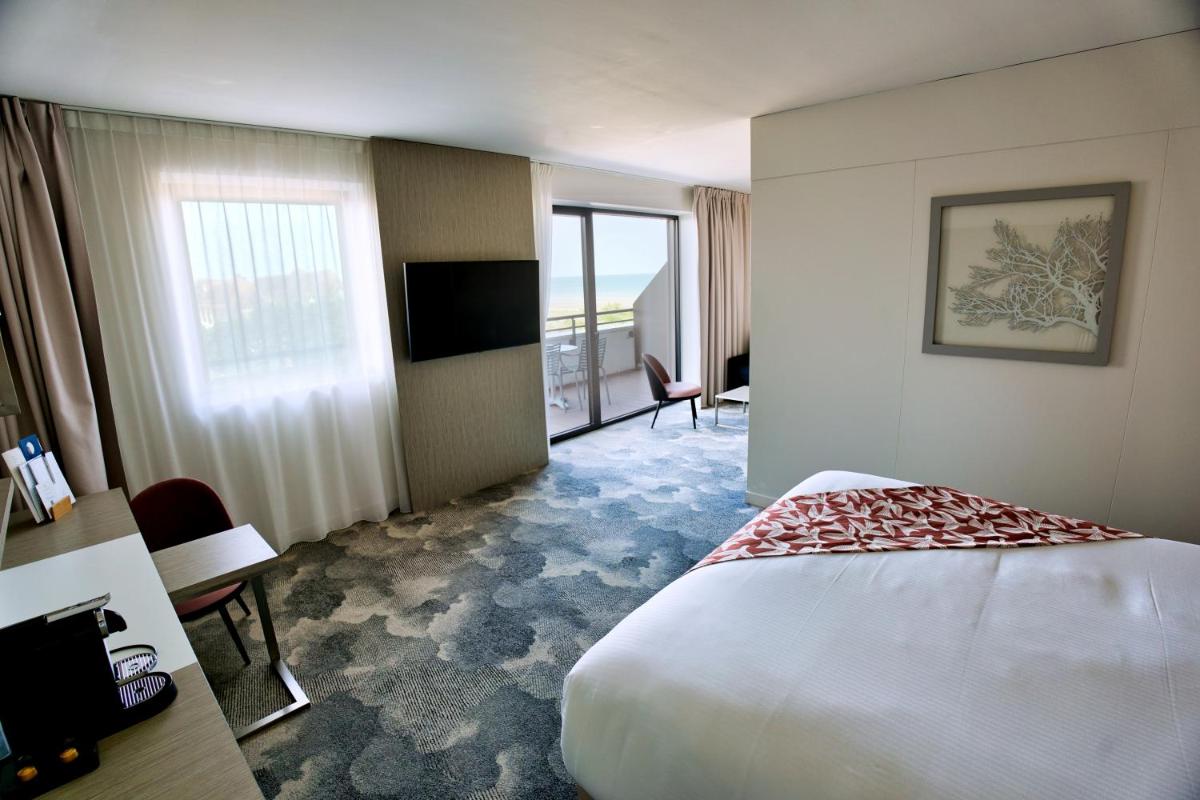 Télévision ou salle de divertissement dans l'établissement Thalazur Cabourg - Hôtel & Spa