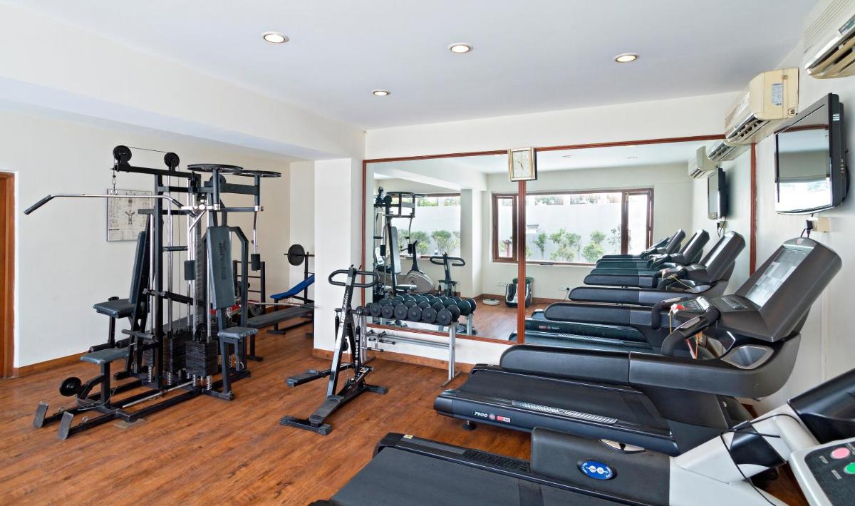 a gym with a row of treadmills and machines at Clarks Avadh in Lucknow