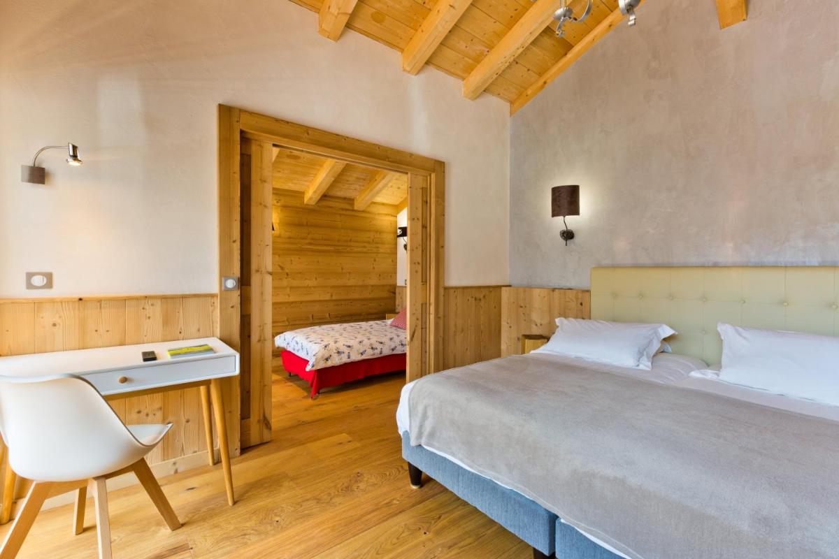 Un ou plusieurs lits dans un hébergement de l'établissement Hotel Alpina