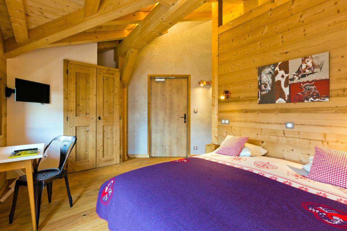 Un ou plusieurs lits dans un hébergement de l'établissement Hotel Alpina