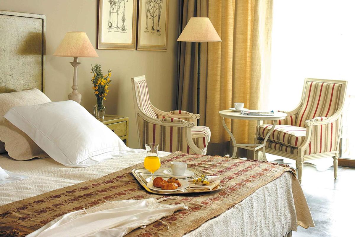 Cama o camas de una habitación en Asia Gardens Hotel & Thai Spa, a Royal Hideaway Hotel