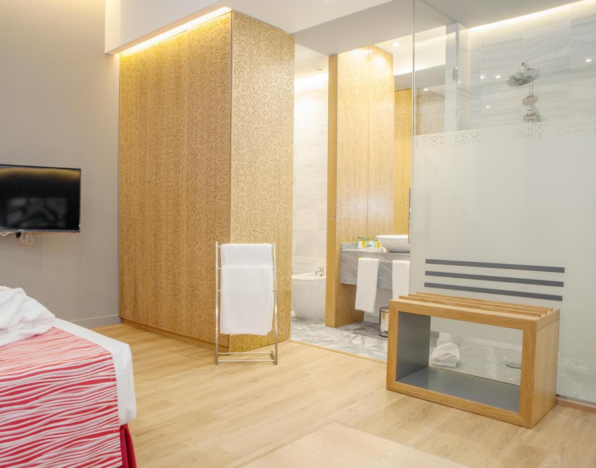 Cama o camas de una habitación en Soho Boutique Capuchinos & Spa