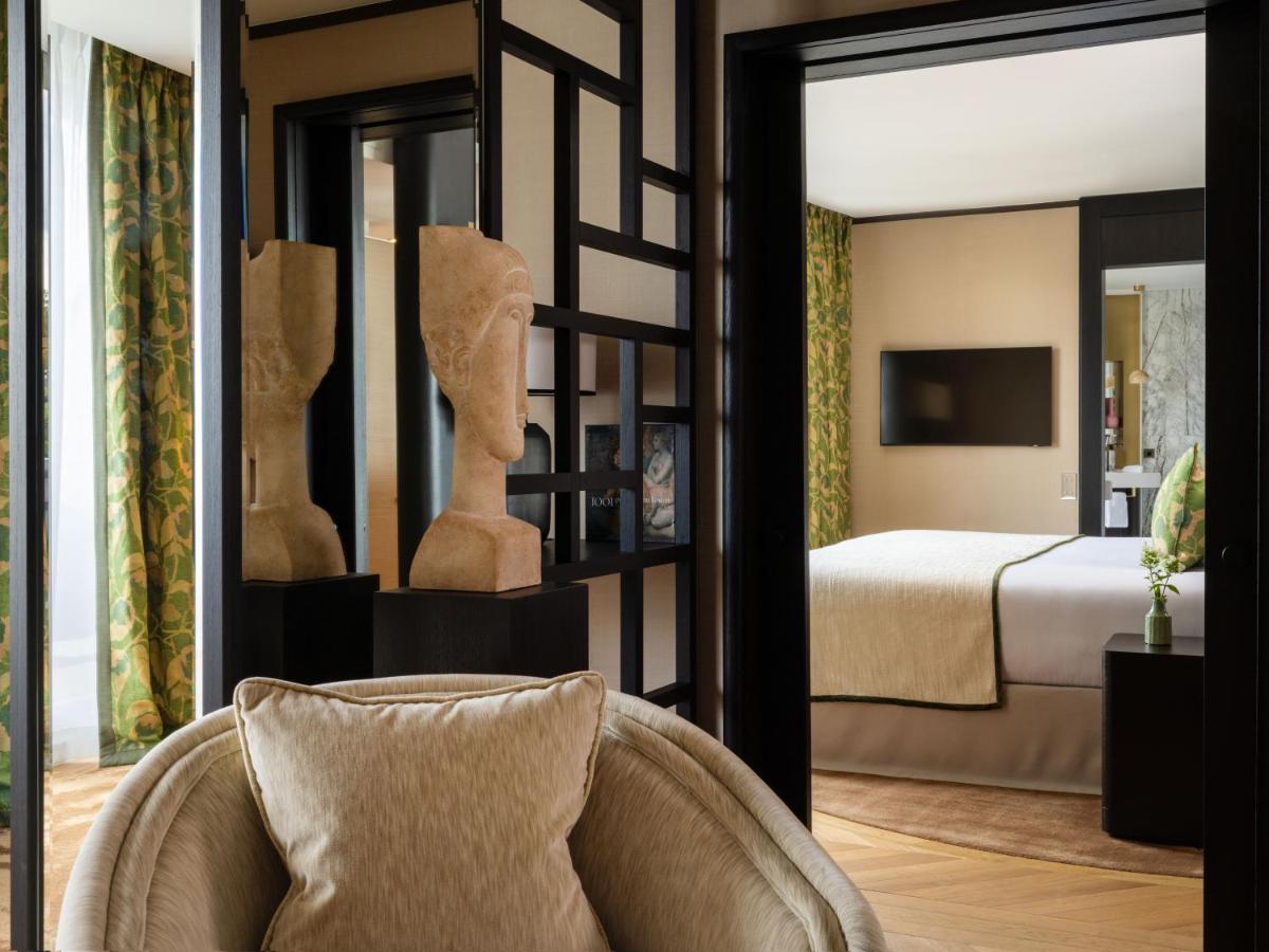 Un ou plusieurs lits dans un hébergement de l'établissement Hôtel De Sers Champs Elysées Paris