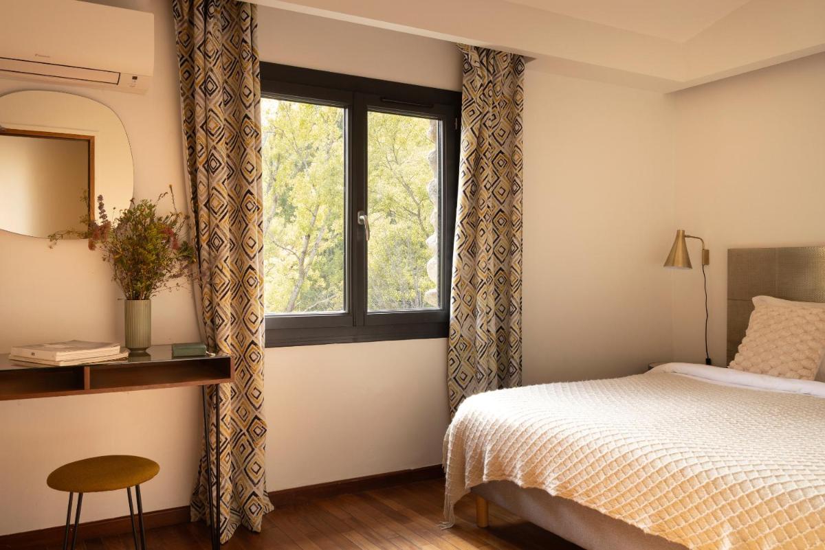 Un ou plusieurs lits dans un hébergement de l'établissement Hotel E Caselle - Demeures & Châteaux