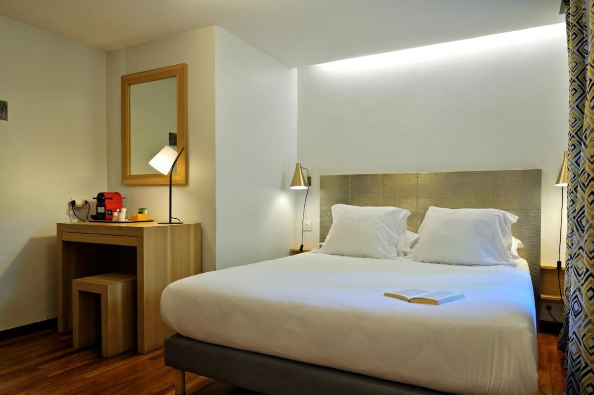 Un ou plusieurs lits dans un hébergement de l'établissement Hotel E Caselle - Demeures & Châteaux