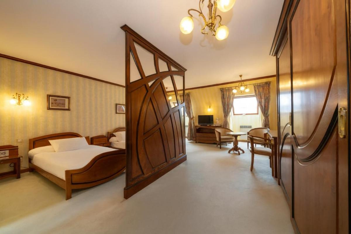 Un ou plusieurs lits dans un hébergement de l'établissement Hotel Munsch Restaurant & Wellness, Colmar Nord - Haut-Koenigsbourg