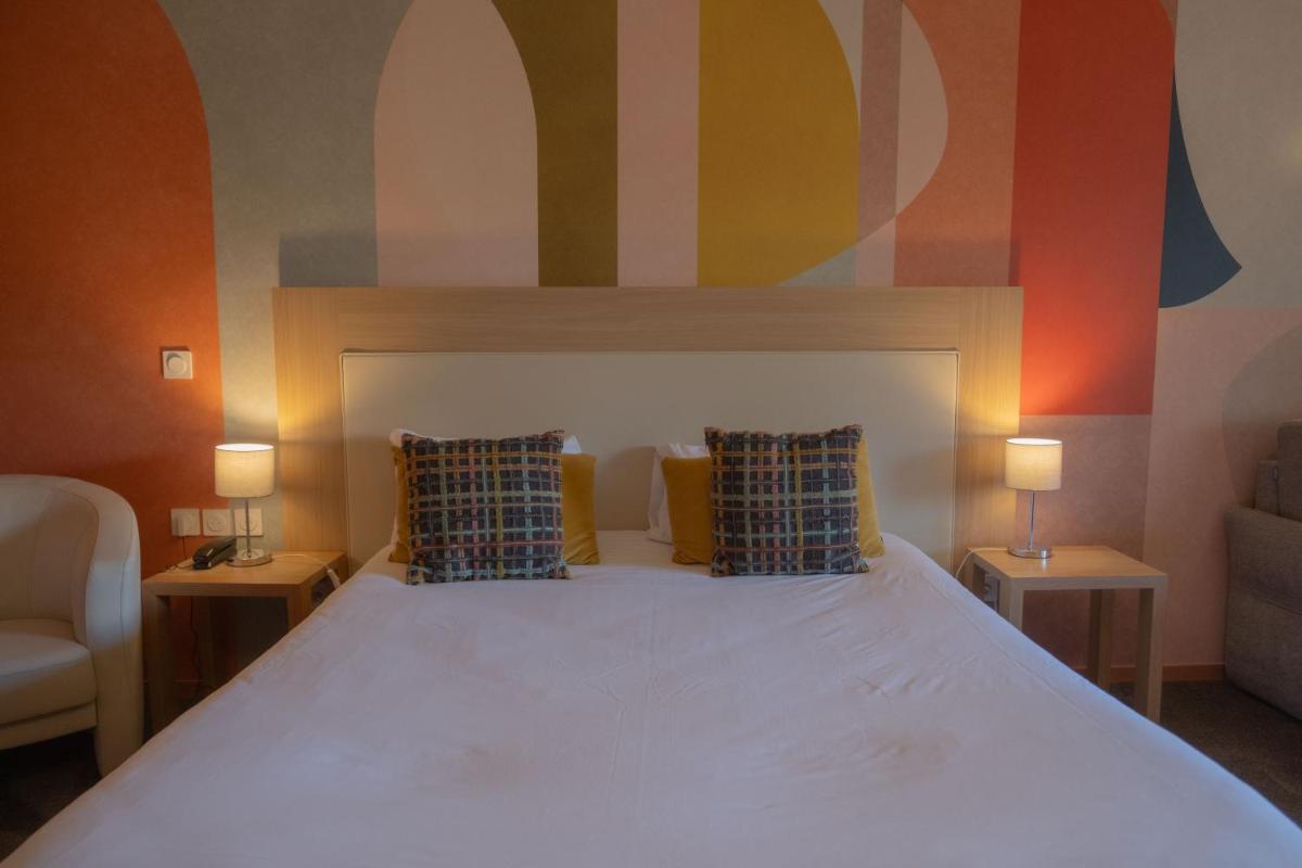 Un ou plusieurs lits dans un hébergement de l'établissement Hotel *** & Spa Vacances Bleues Villa Marlioz