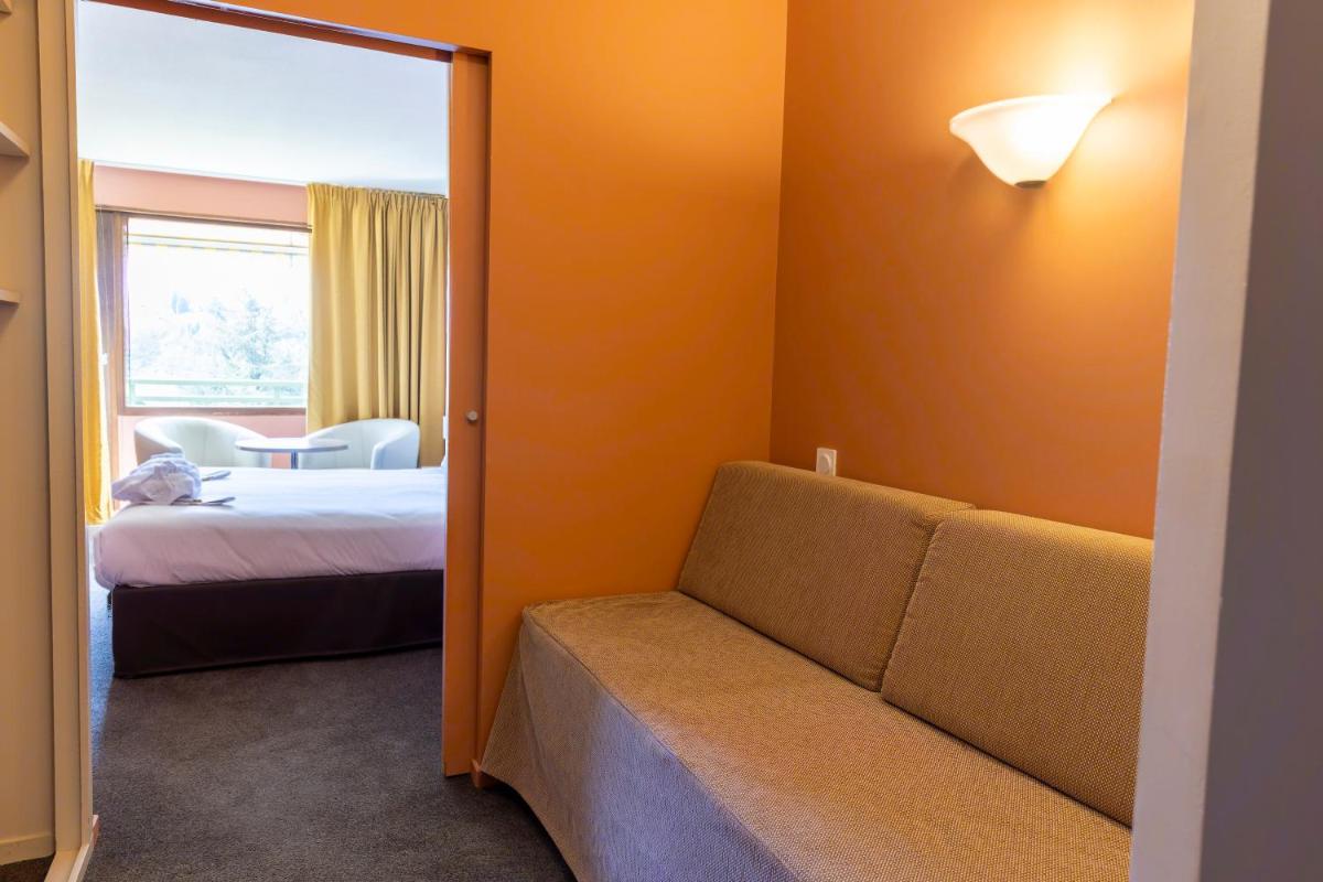 Un ou plusieurs lits dans un hébergement de l'établissement Hotel *** & Spa Vacances Bleues Villa Marlioz