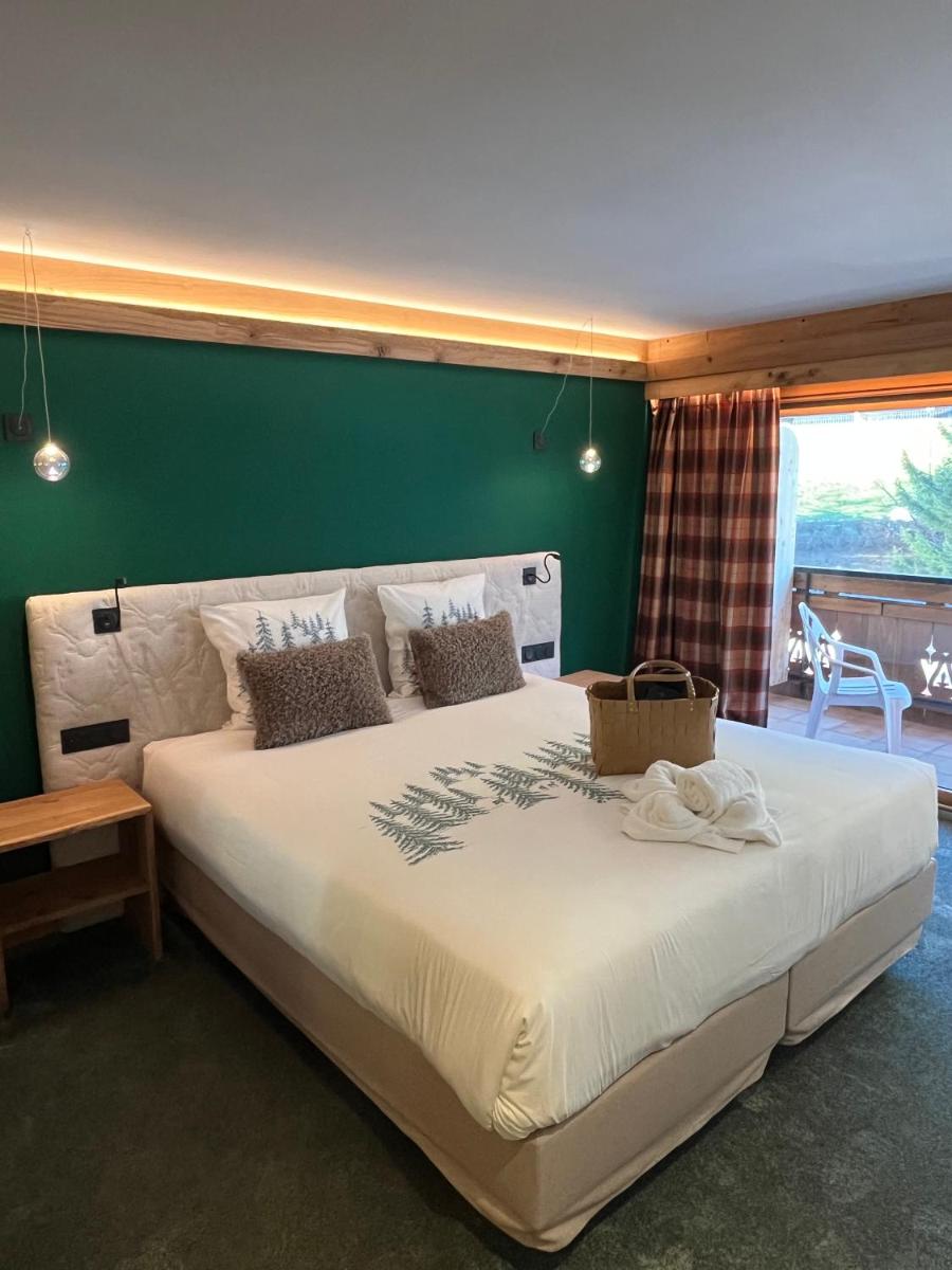 Un ou plusieurs lits dans un hébergement de l'établissement Hôtel Macchi Restaurant & Spa
