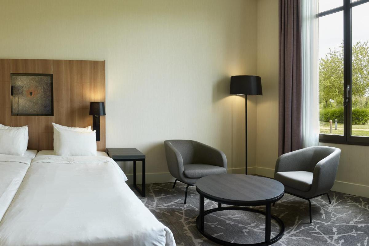 Un ou plusieurs lits dans un hébergement de l'établissement Hotel Paris Marne-la-Vallee by IHG