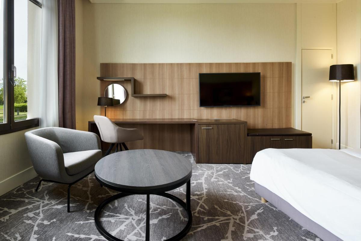 Télévision ou salle de divertissement dans l'établissement Hotel Paris Marne-la-Vallee by IHG