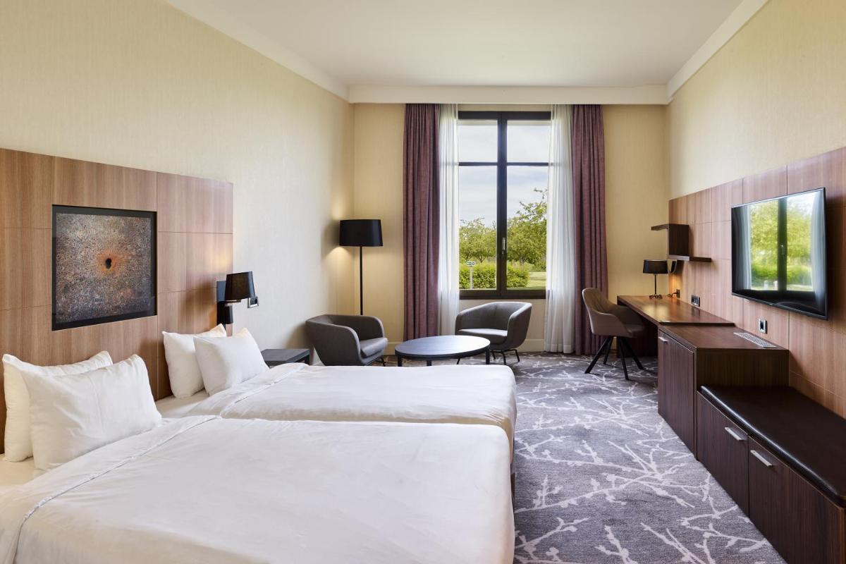 Un ou plusieurs lits dans un hébergement de l'établissement Hotel Paris Marne-la-Vallee by IHG