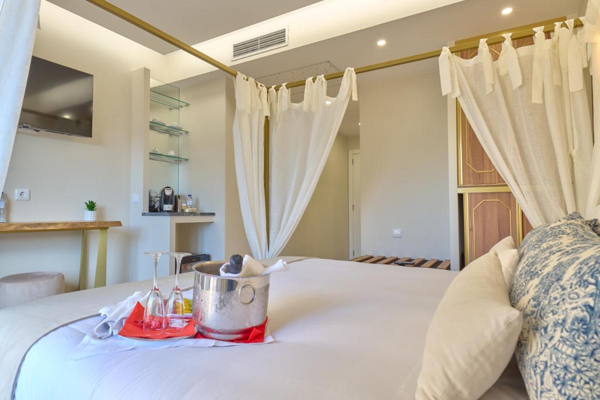 Uma cama ou camas num quarto em Hotel de Ilhavo Plaza & Spa