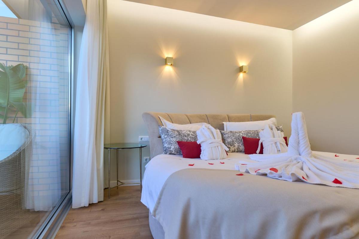 Uma cama ou camas num quarto em Hotel de Ilhavo Plaza & Spa
