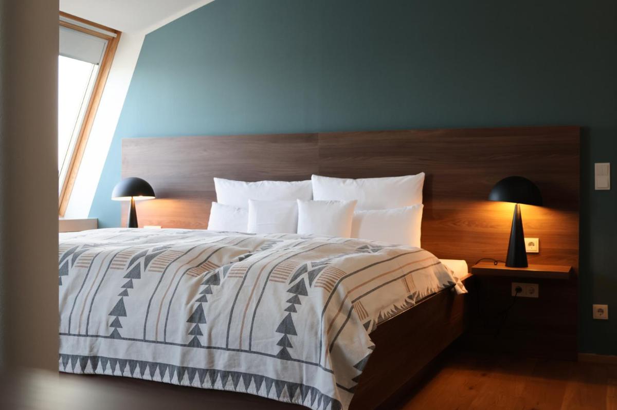 Ein Bett oder Betten in einem Zimmer der Unterkunft THE GRAND Ahrenshoop