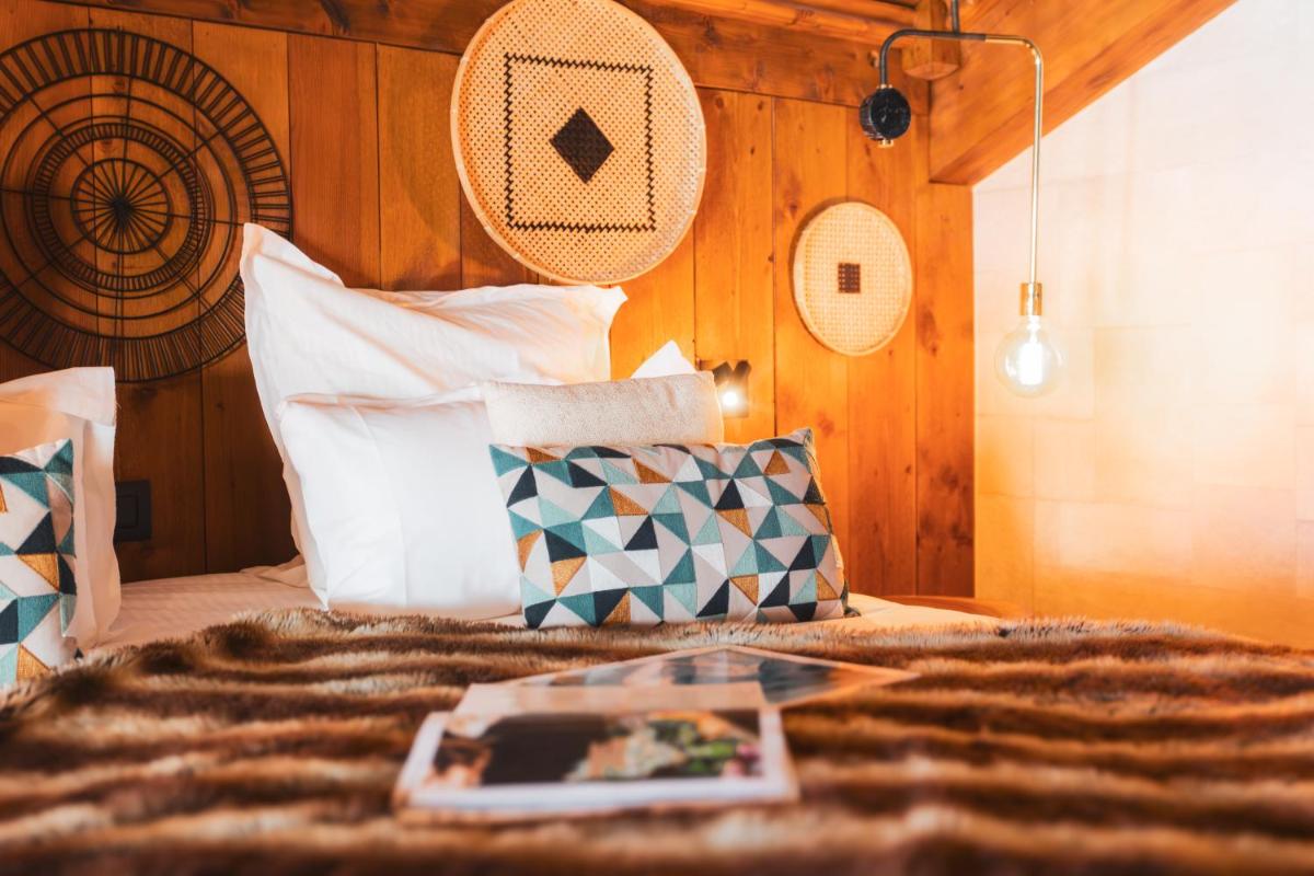 Un ou plusieurs lits dans un hébergement de l'établissement Hôtel Village Montana by Les Etincelles