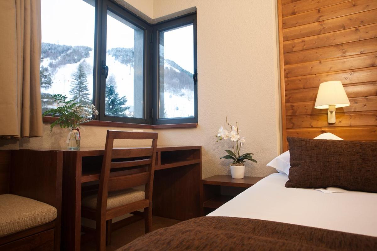 Cama o camas de una habitación en Tuc Blanc