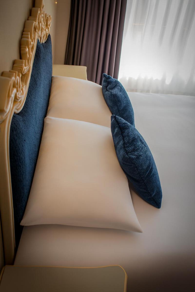 Un ou plusieurs lits dans un hébergement de l'établissement Alexain Hotel Restaurant & Wellness - Colmar Ouest