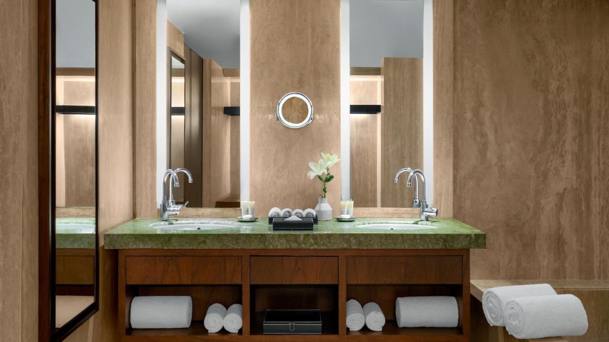 a bathroom with a sink and a mirror at Park Hyatt Chennai in Chennai