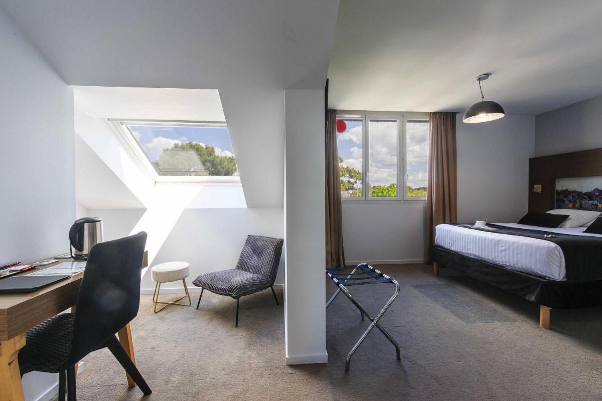 Un ou plusieurs lits dans un hébergement de l'établissement Best Western Hôtel Garden and Spa