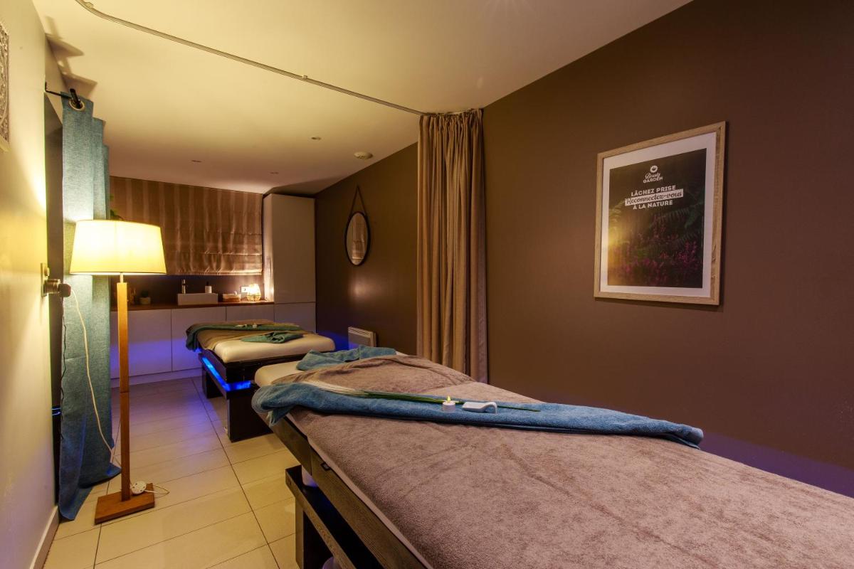Un ou plusieurs lits dans un hébergement de l'établissement Best Western Hôtel Garden and Spa