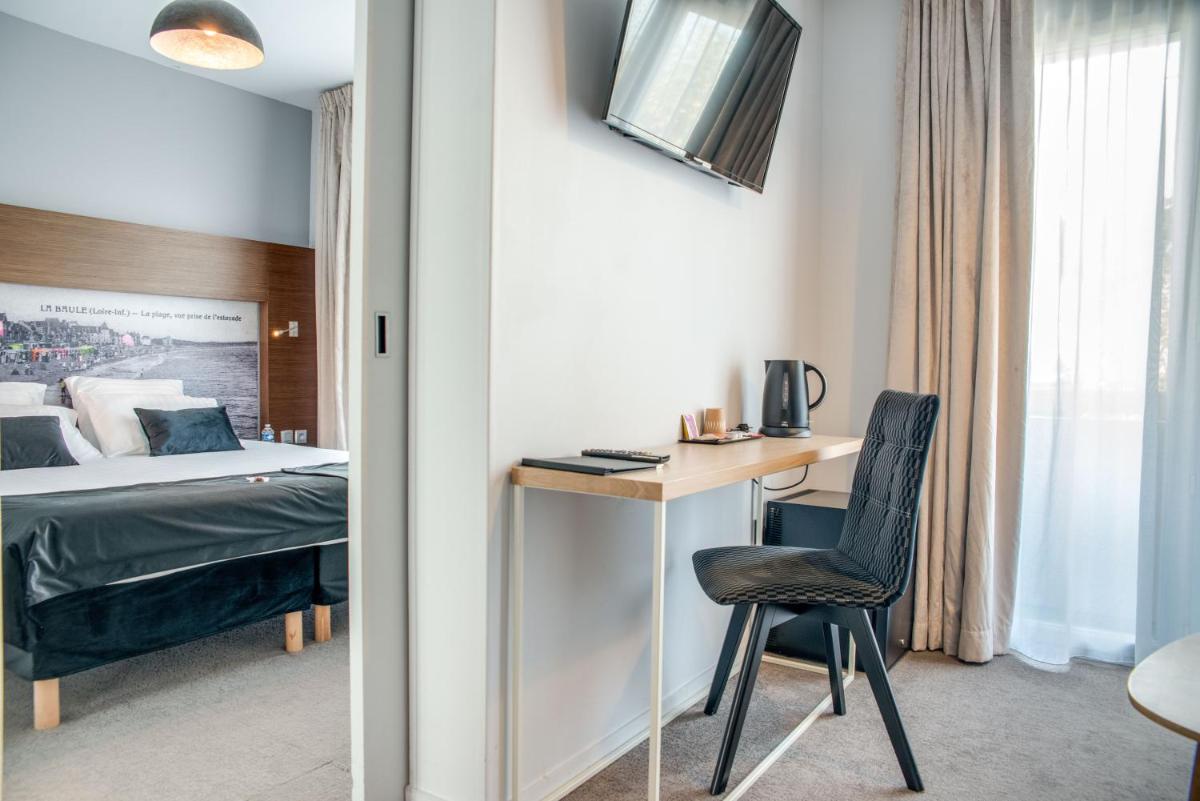 Un ou plusieurs lits dans un hébergement de l'établissement Best Western Hôtel Garden and Spa