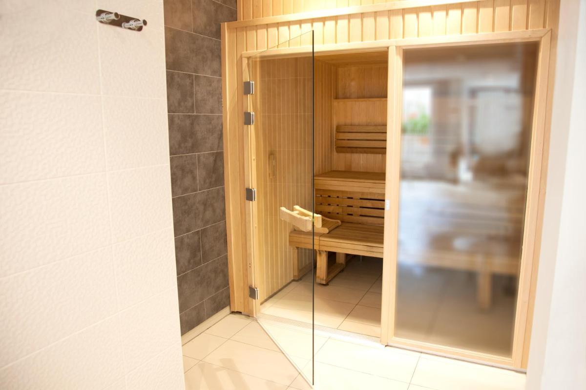 Un ou plusieurs lits dans un hébergement de l'établissement Best Western Hôtel Garden and Spa