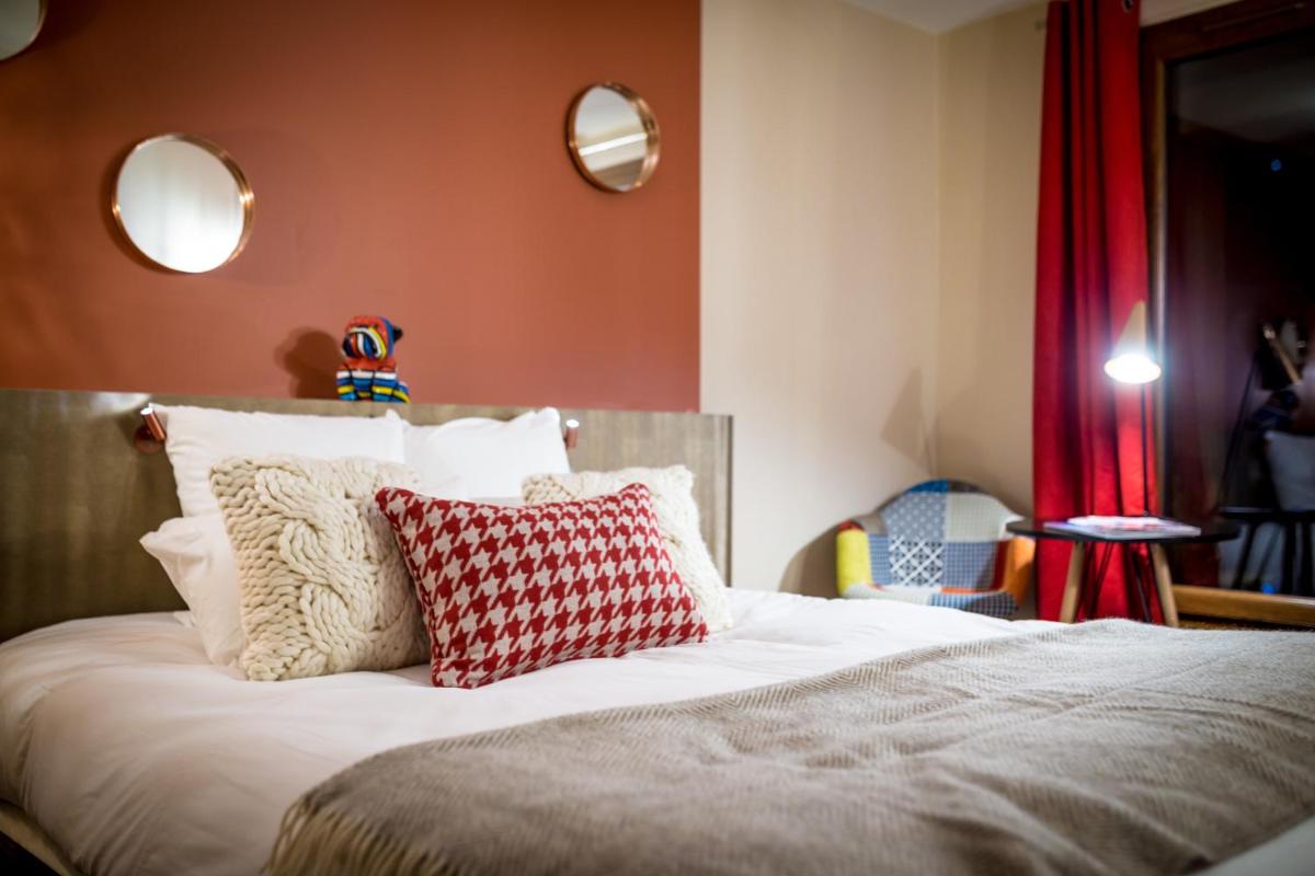 Un ou plusieurs lits dans un hébergement de l'établissement Grandes Rousses Hotel & Spa