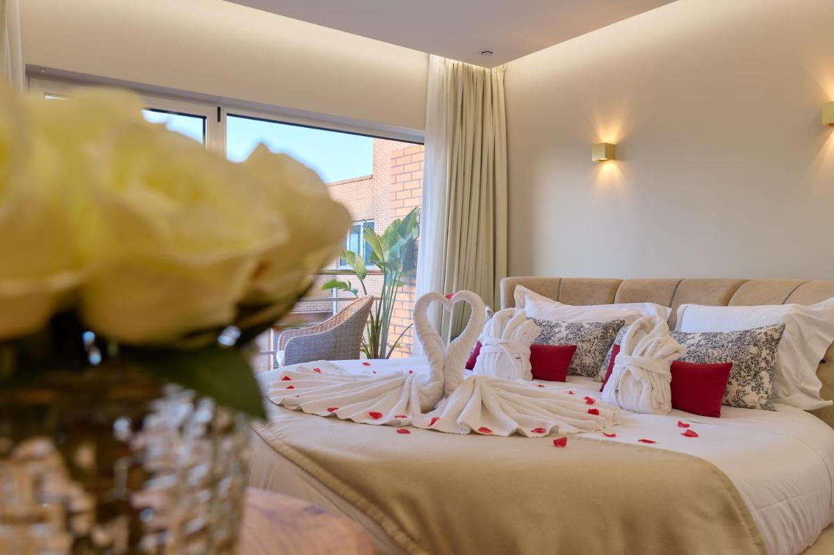 Uma cama ou camas num quarto em Hotel de Ilhavo Plaza & Spa