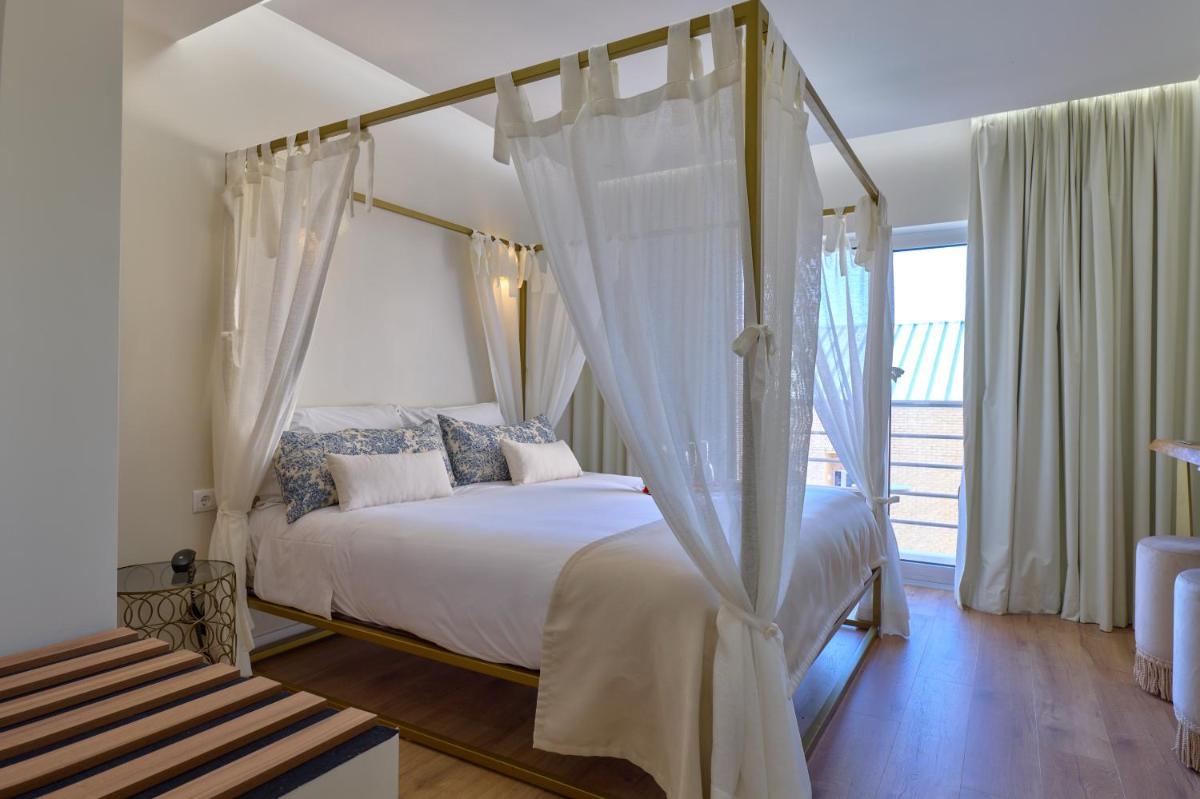 Uma cama ou camas num quarto em Hotel de Ilhavo Plaza & Spa