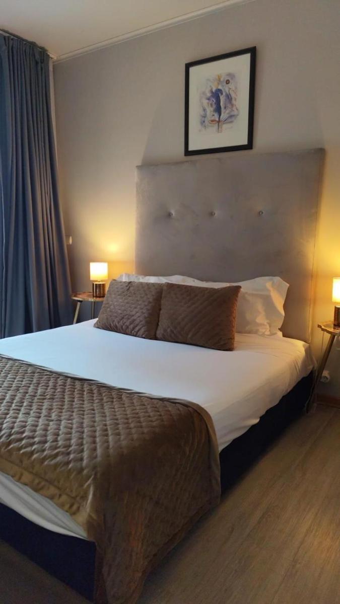 Uma cama ou camas num quarto em Hotel de Ilhavo Plaza & Spa