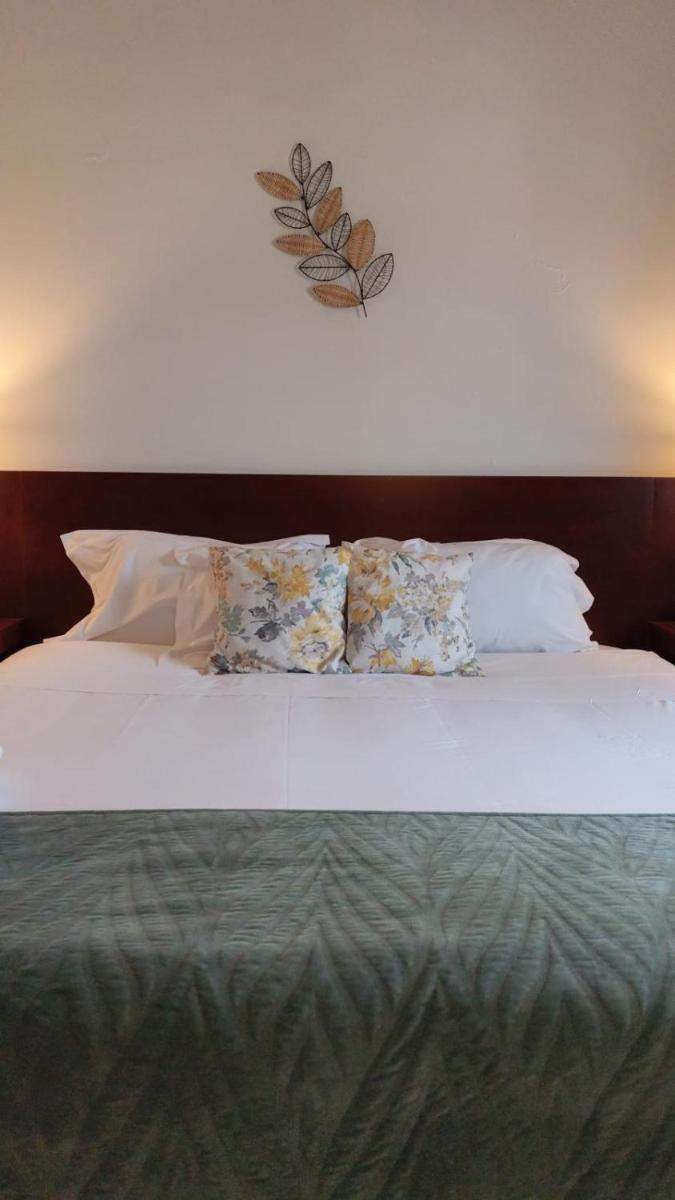 Uma cama ou camas num quarto em Hotel de Ilhavo Plaza & Spa