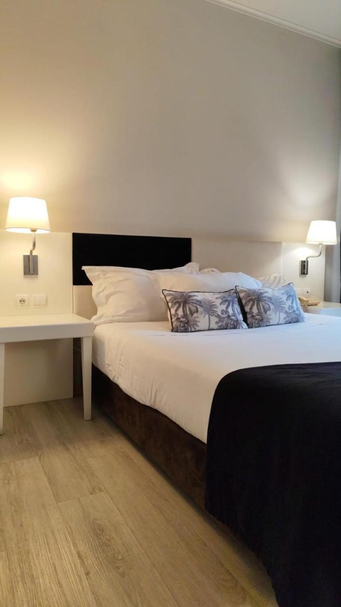 Uma cama ou camas num quarto em Hotel de Ilhavo Plaza & Spa