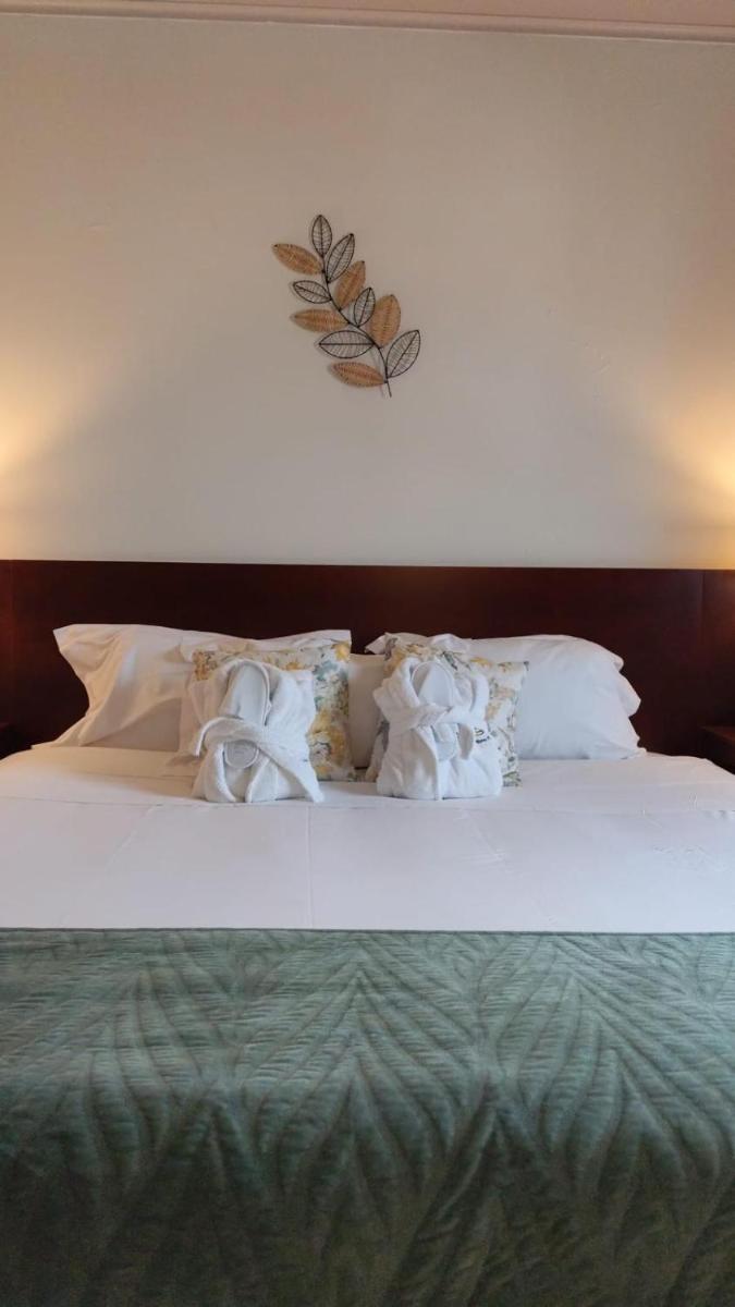 Uma cama ou camas num quarto em Hotel de Ilhavo Plaza & Spa