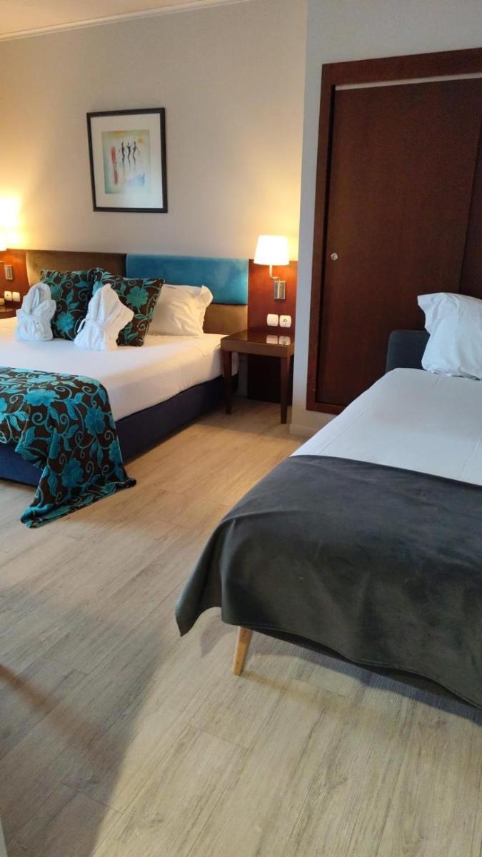 Uma cama ou camas num quarto em Hotel de Ilhavo Plaza & Spa