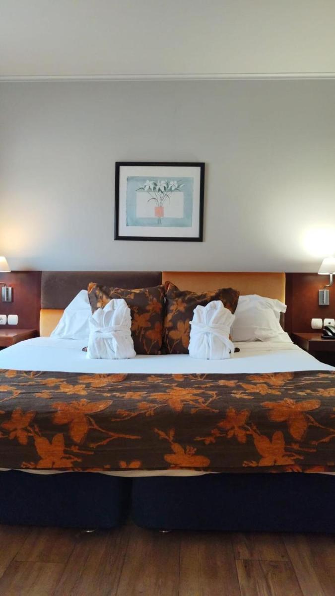 Uma cama ou camas num quarto em Hotel de Ilhavo Plaza & Spa