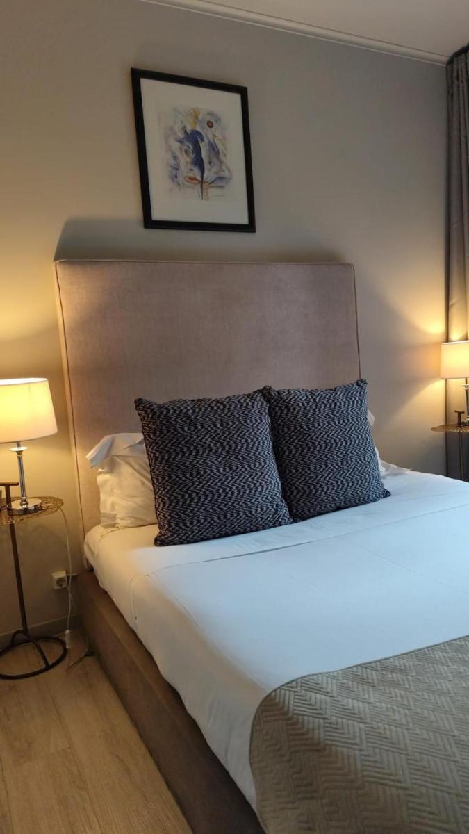 Uma cama ou camas num quarto em Hotel de Ilhavo Plaza & Spa