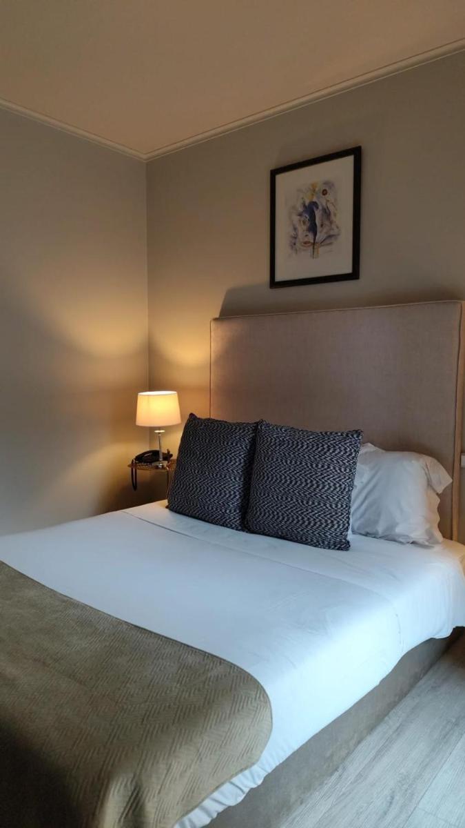 Uma cama ou camas num quarto em Hotel de Ilhavo Plaza & Spa