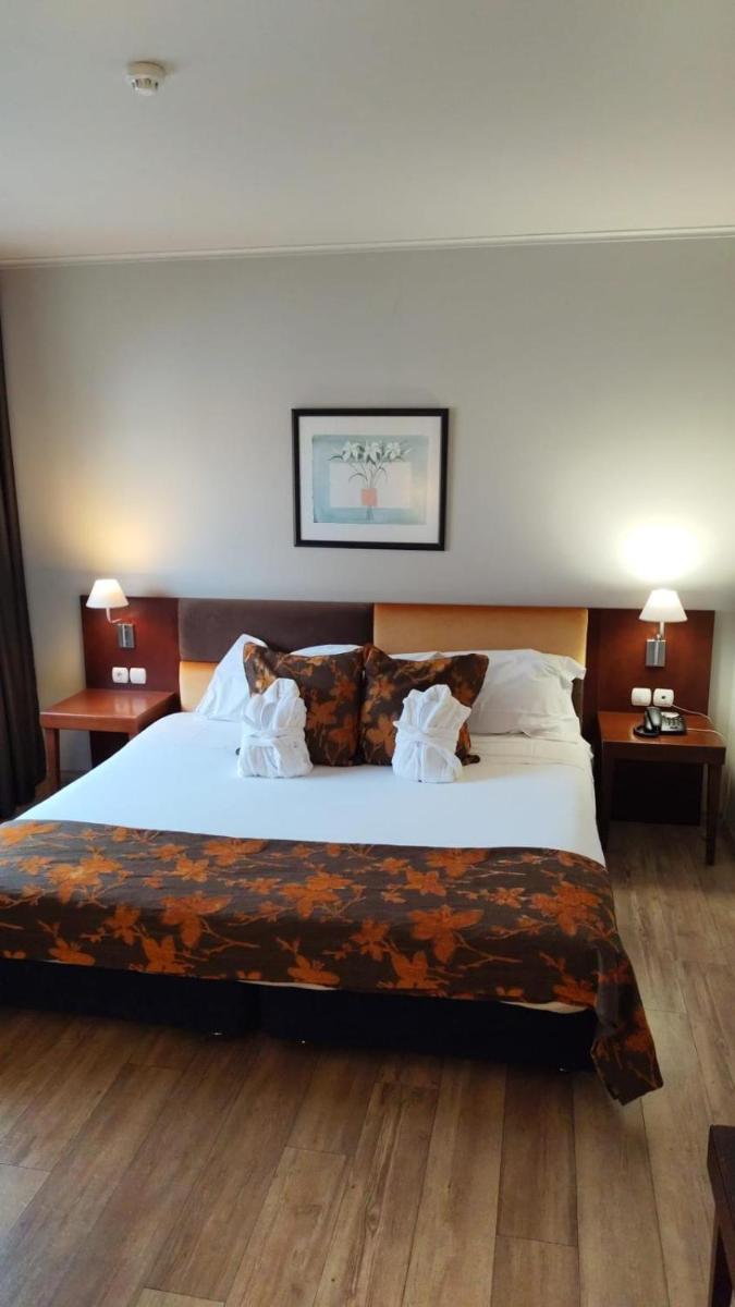 Uma cama ou camas num quarto em Hotel de Ilhavo Plaza & Spa