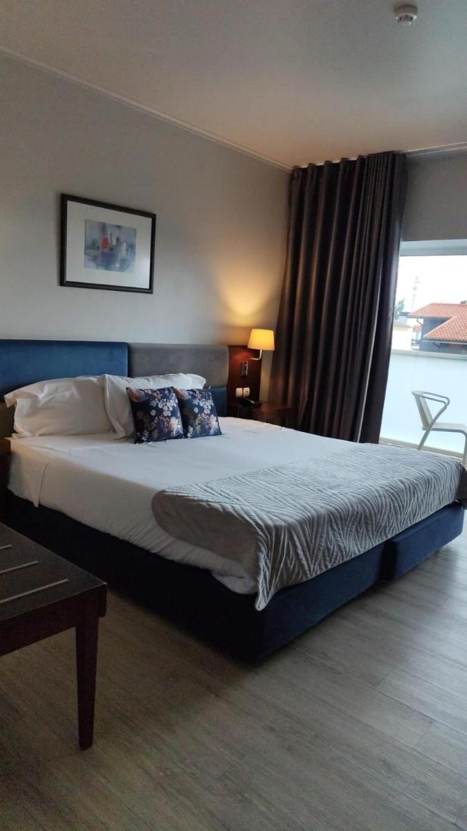 Uma cama ou camas num quarto em Hotel de Ilhavo Plaza & Spa