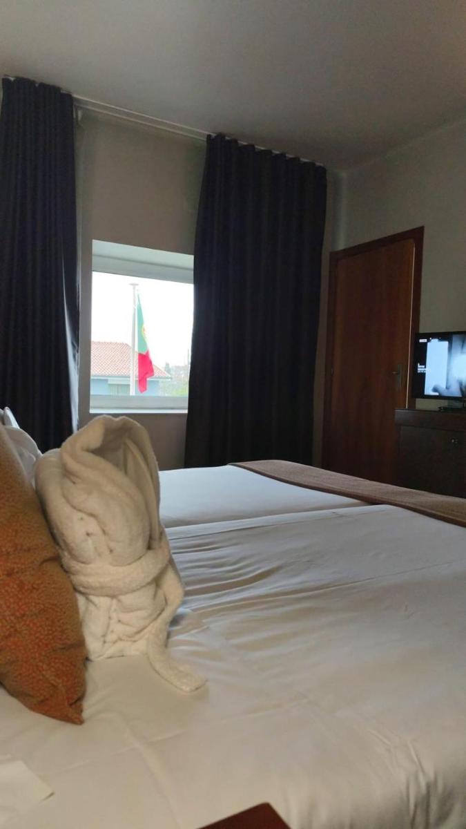 Uma cama ou camas num quarto em Hotel de Ilhavo Plaza & Spa