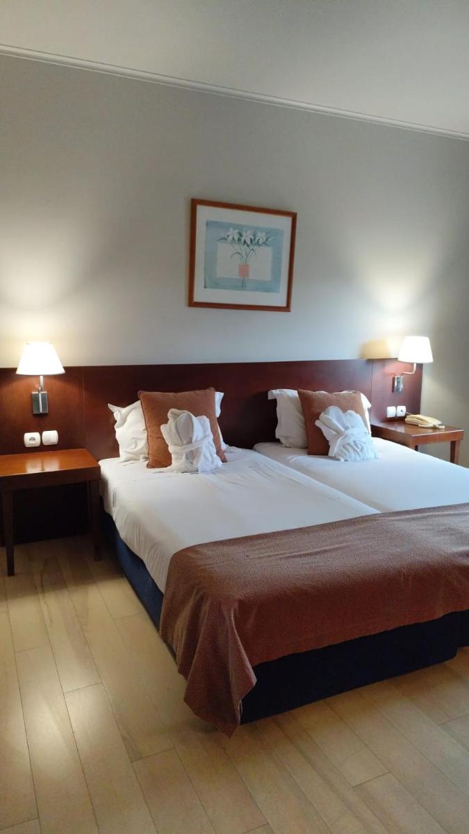 Uma cama ou camas num quarto em Hotel de Ilhavo Plaza & Spa