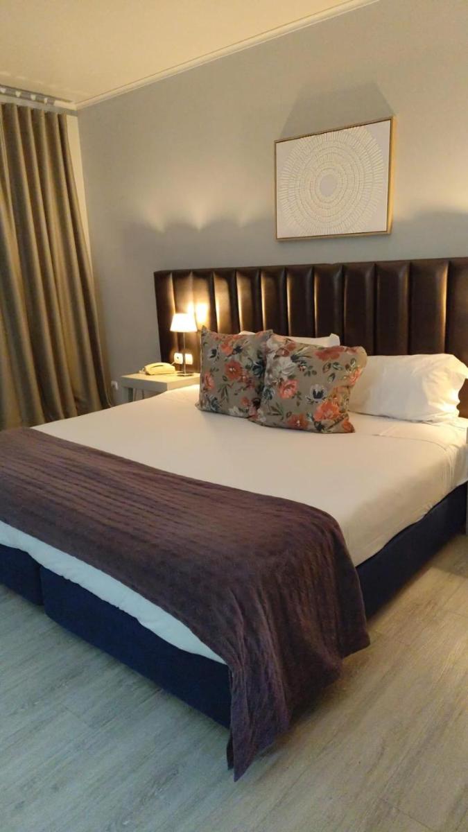 Uma cama ou camas num quarto em Hotel de Ilhavo Plaza & Spa
