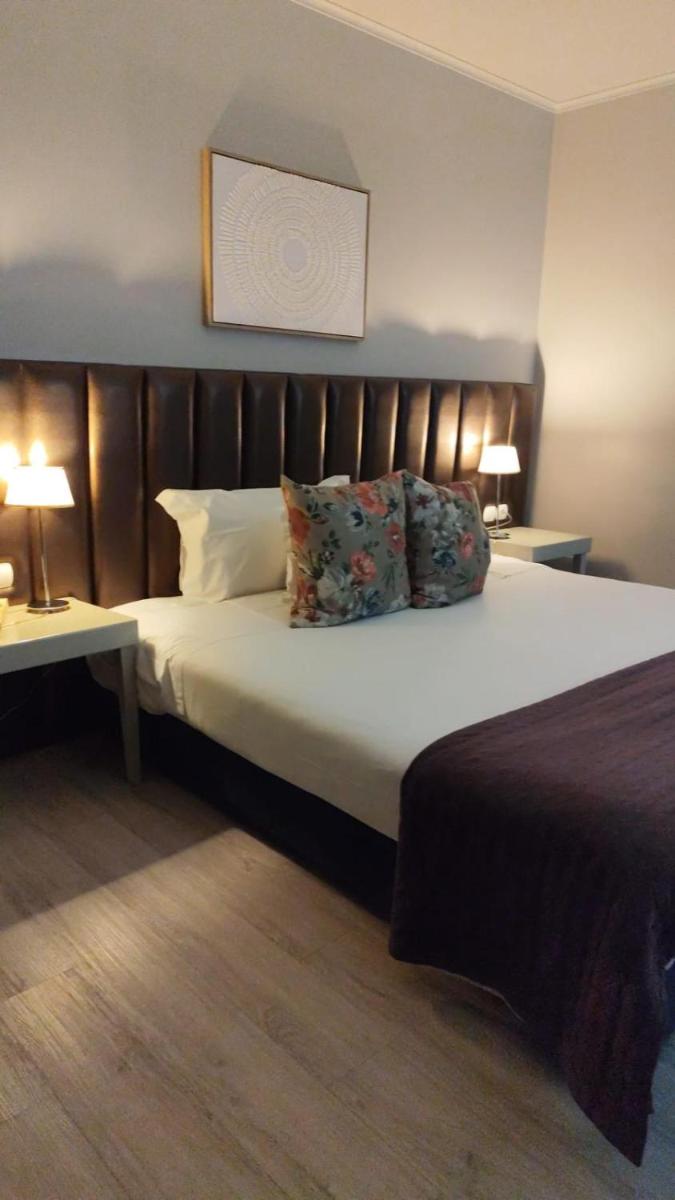 Uma cama ou camas num quarto em Hotel de Ilhavo Plaza & Spa