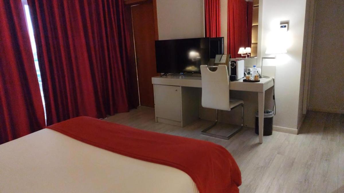 Uma cama ou camas num quarto em Hotel de Ilhavo Plaza & Spa